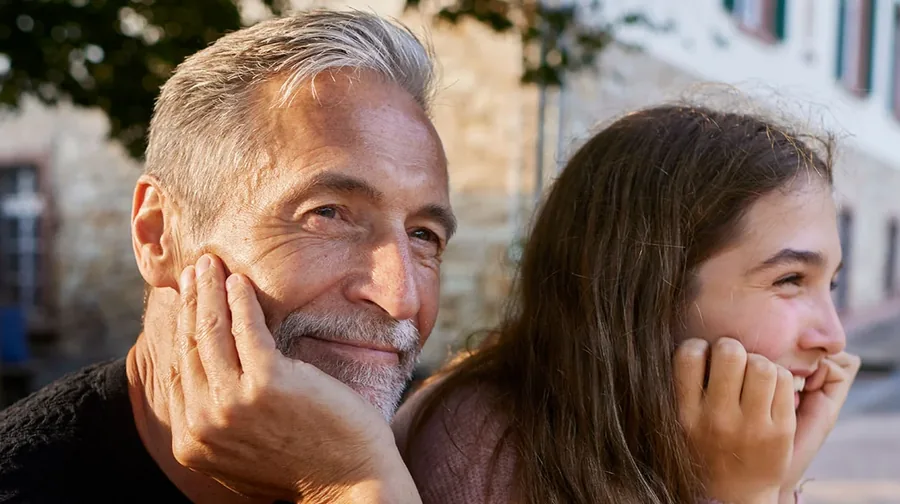 Julius Baer Family Barometer 2026: two generations, a grey-haired man and a girl smiling side by side